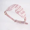 A chic pink eye mask from an electro-stimulation bed restraints set, featuring bold "SPOILED" text printed in a playful font across its surface. The mask has a smooth, glossy finish and is designed to comfortably cover the eyes while enhancing sensory play. It includes a soft adjustable strap with gold metal hardware, ensuring a secure fit. Displayed on a clear acrylic stand against a clean white background, this eye mask is a stylish piece of bed restraints set, perfect for those looking to explore intimacy and excitement with a touch of elegance and flair.